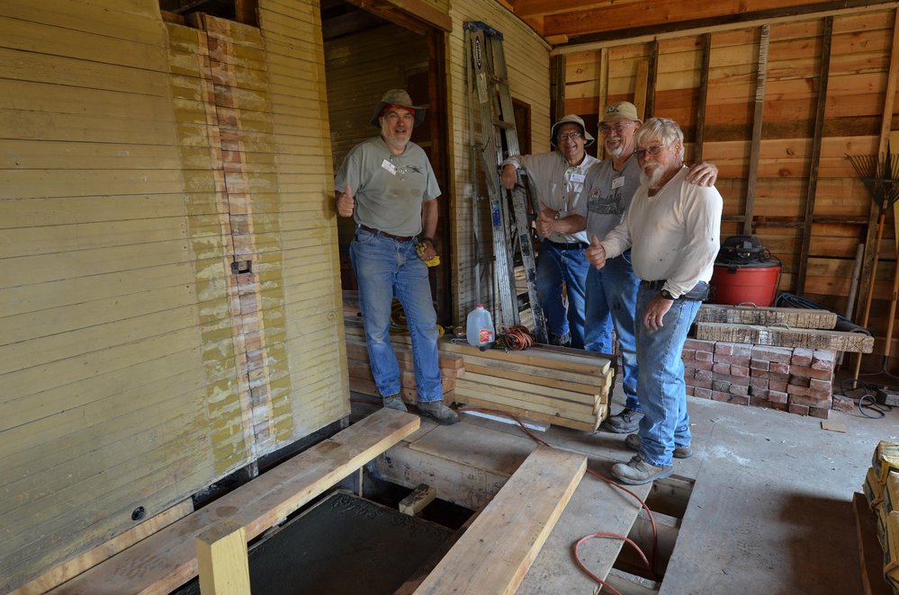 2018-08-01 The crew gives a thumbs up having finished the pour for the fireplace base.jpg