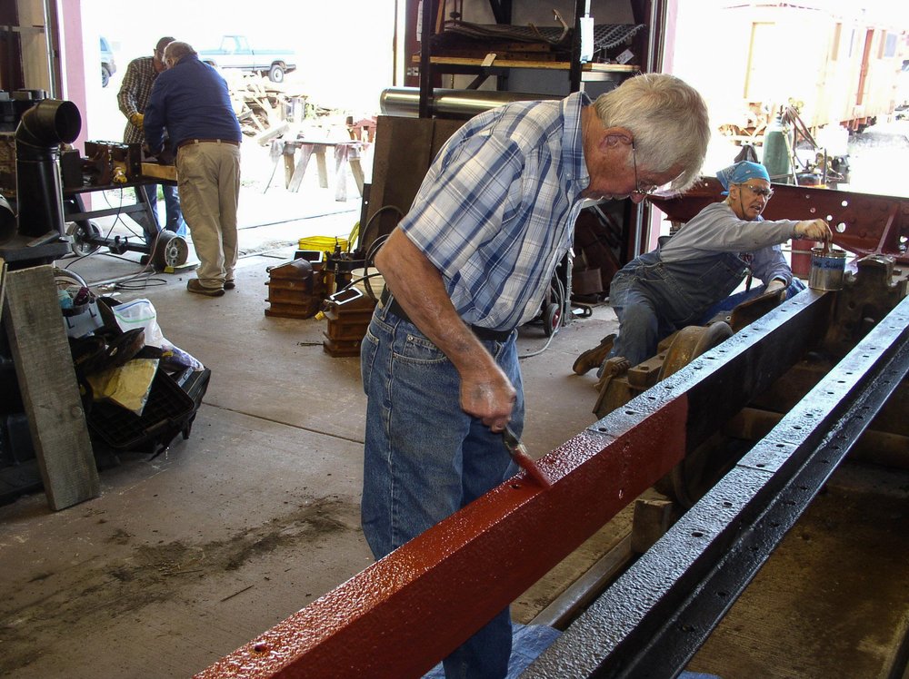 2018-08-02 The frame of the drop bottom gon is getting a red primer coat to protect the metal.jpg