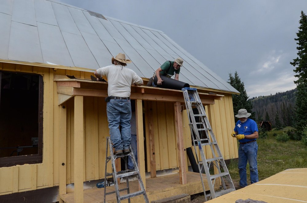 2018-08-02 The porch roof at the car inspectors house is getting tar paper over the finished boards.jpg