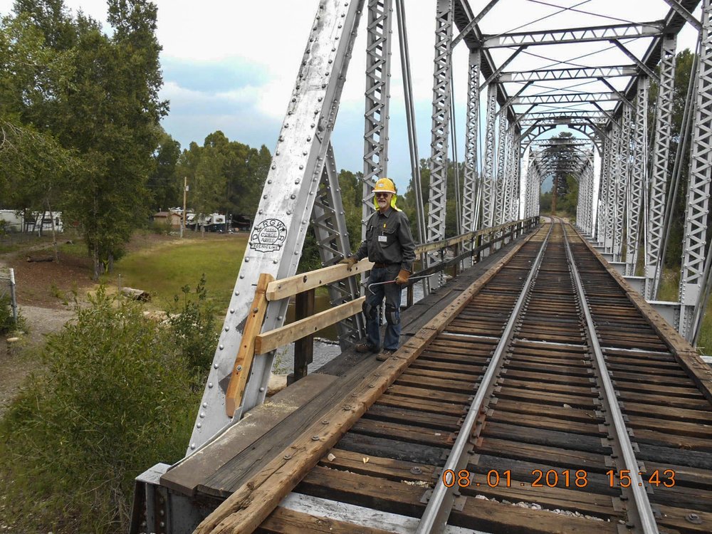 2018-08-01 A smiling Friend standing by some of the repairs made.jpg