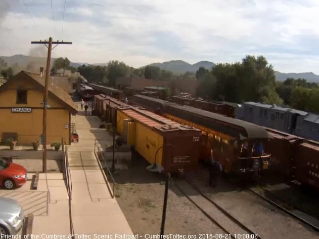 2018-08-21 With raised arm, the conductor gives the high ball for train 216 to depart Chama.jpg