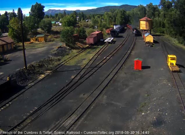 2018-08-30 The 487 comes by the tank as it brings a 7 car train 215 into Chama.jpg