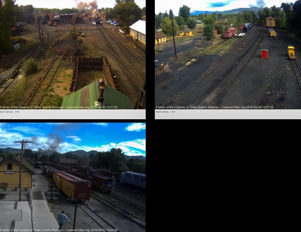 2018-09-03 The last cars of 216 are rounding the curve as the caboose of the special passes the depot.jpg