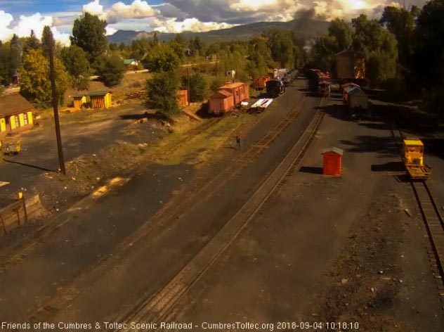 2018-09-04 Exiting the yard as the caboose passes the tank.jpg
