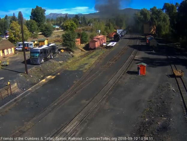 2018-09-10 The last cars are rounding the curve under that hanging smoke.jpg