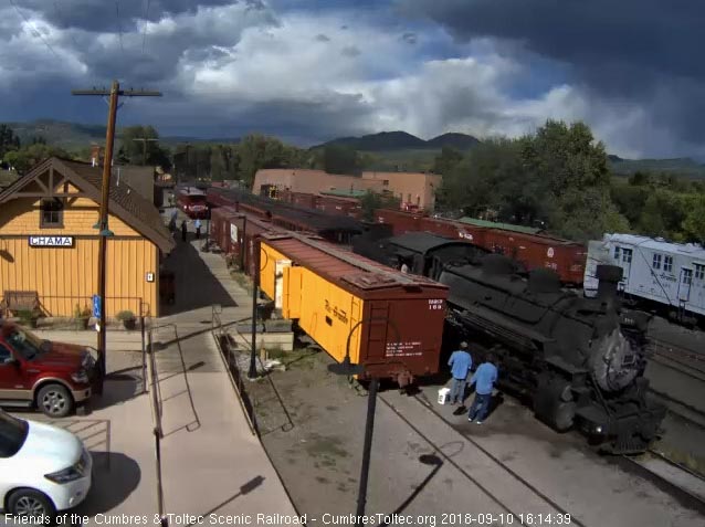 2018-09-10 The train is almost stopped as the 484 passes the crew waiting to board.jpg