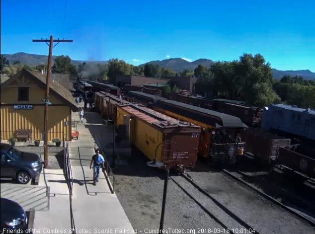 2018-09-18 The high ball given, the conductor climbs on a crowded parlor platform.jpg