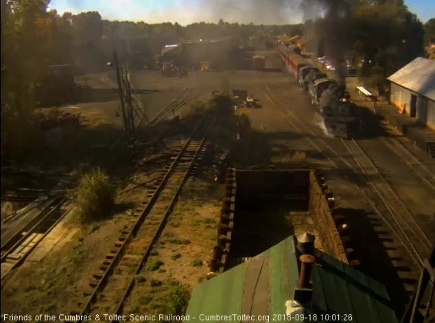2018-09-18 The 489 and 463 get this 10 car train underway by an open woodshop.jpg