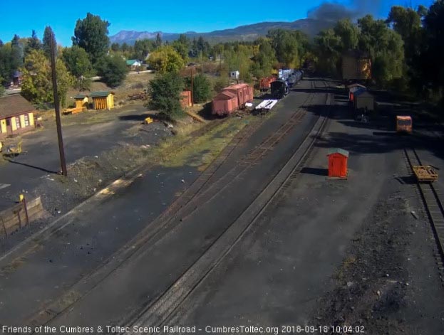 2018-09-18 The smoke hangs over the trees as the last cars round the curve.jpg