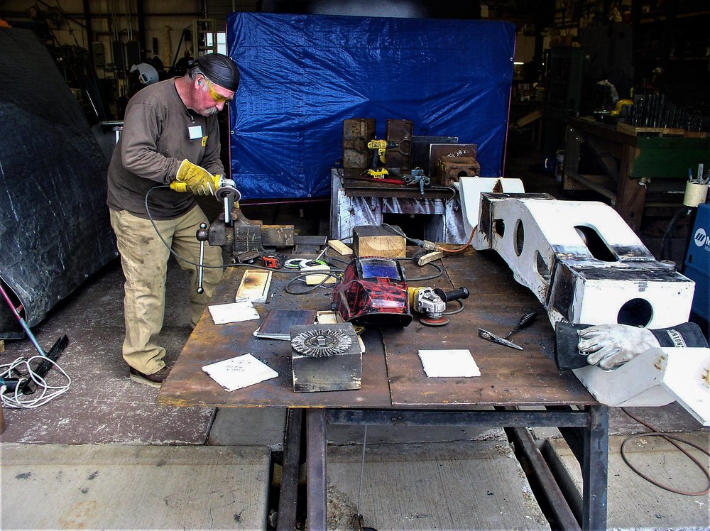 2018-09-25 Using an angle grinder to clean up a part.jpg