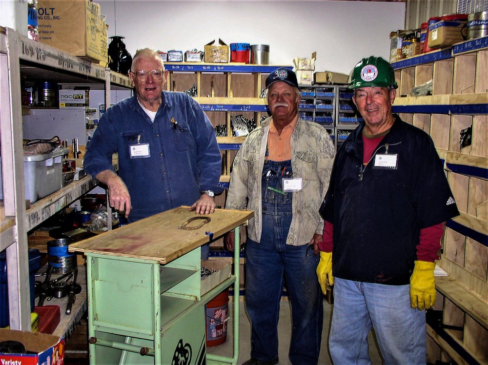 2018-09-25 Some of the crew in the stock room getting supplies for their tasks.jpg