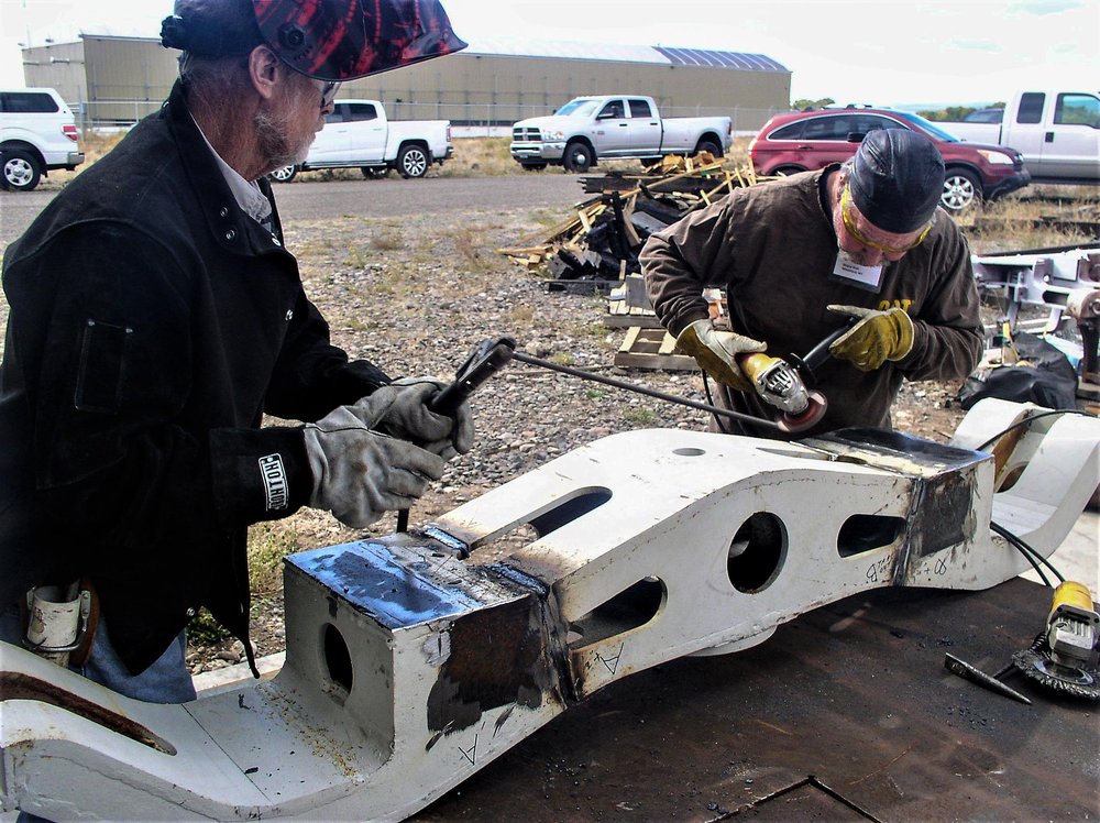 2018-09-25 Some welding has been done on this truck frame and they are cleaning up.jpg