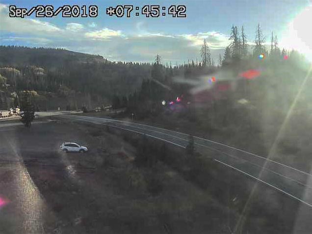 2018-09-26 The early morning sun glints off the 19 and its ballast hoppers At Cumbres Pass.jpg