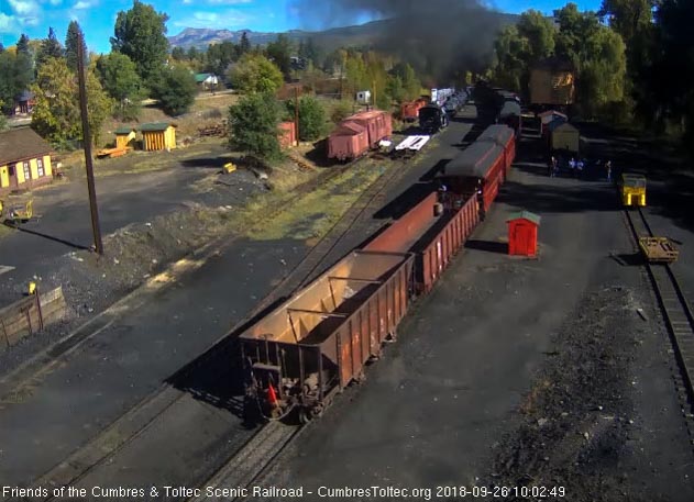 2018-09-26 The rider gon and hopper come into view as the locomotives clear the yard and into the curve.jpg