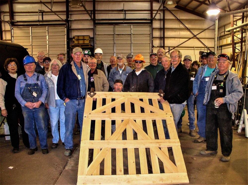 2018-09-26 Using one of the new car doors as a prop we have the group photo of the session G participants.jpg