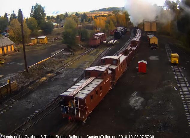 2018-10-09 The conductor and one other person are on the back platform of the second caboose.jpg