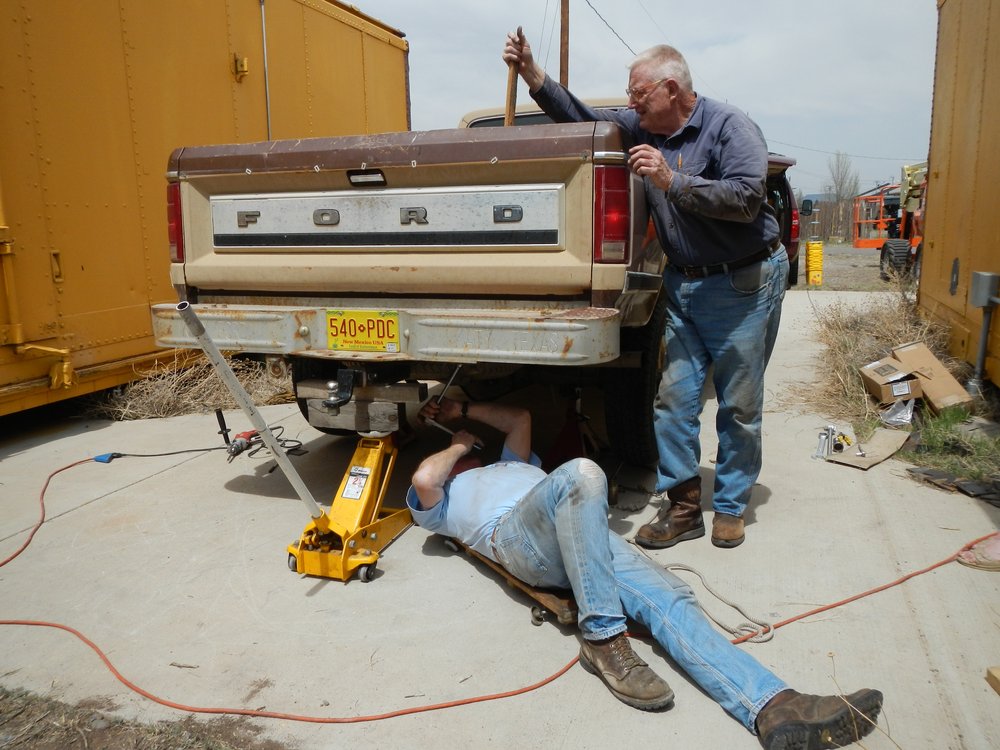 Russ Hanscom and Marshall Smith work on the Friends' Ford truck - installing gooseneck trailer hitch..jpg