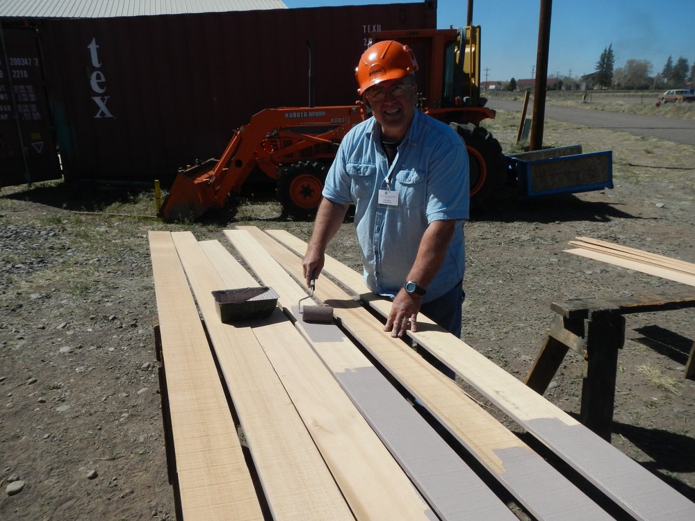 Bruce Bloom primes cedar siding for the Osier Section House..jpg