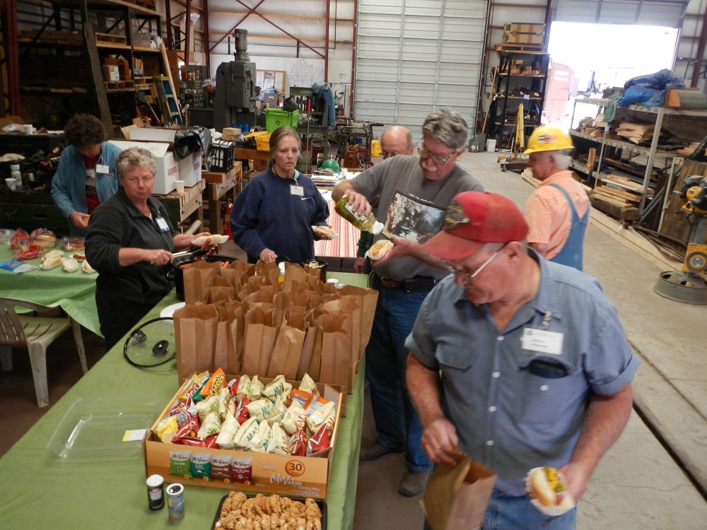 Lunch time!  Hot dogs with sauerkraut and all the fixin's - with Patty's homemade cookies!  L-R, Mary Jane Smith, Patty Hanscom, Mary Lowes (first-year volunteer), Craig McMullen and Bob Reib..jpg