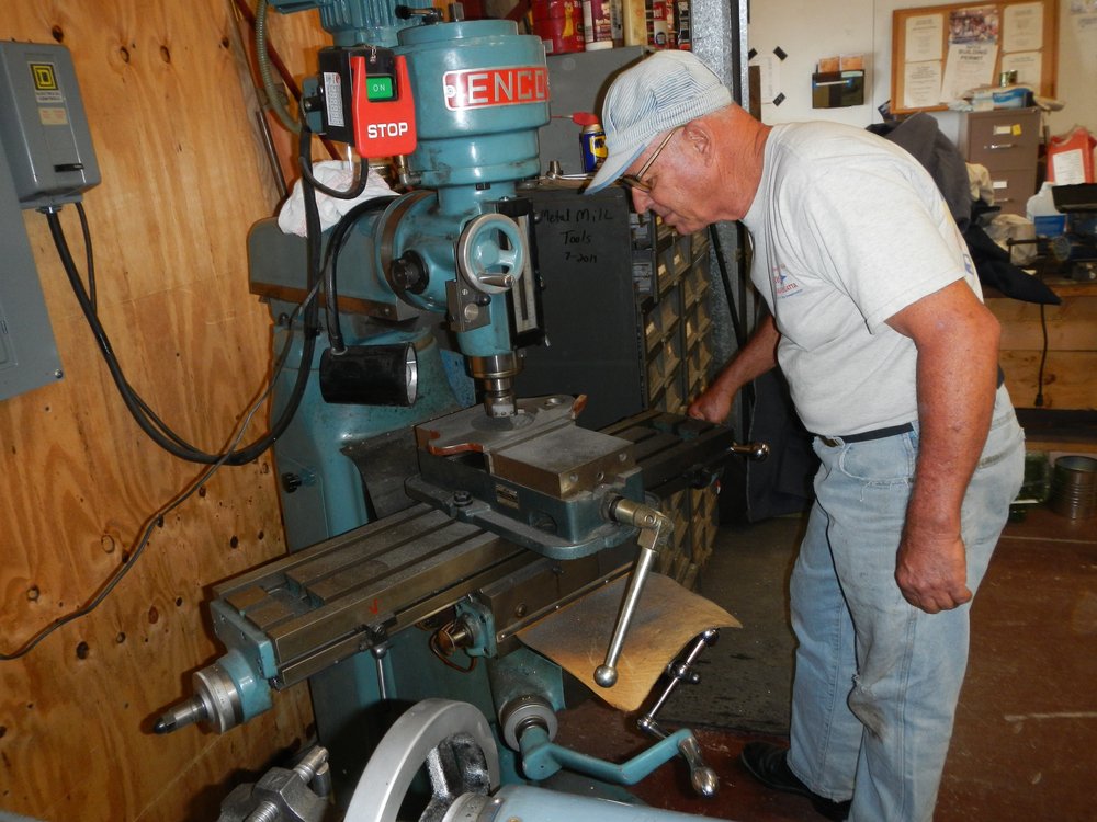 New Volunteer Grant Ball runs machine used to mill truck parts.jpg