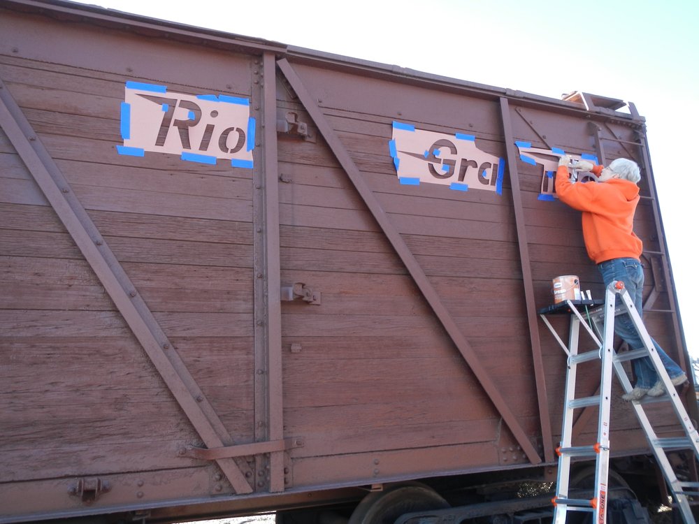 Valley Lowrance stenciling Standard Gauge Box cars near the Antonito Depot.  Wind is blowing!.jpg