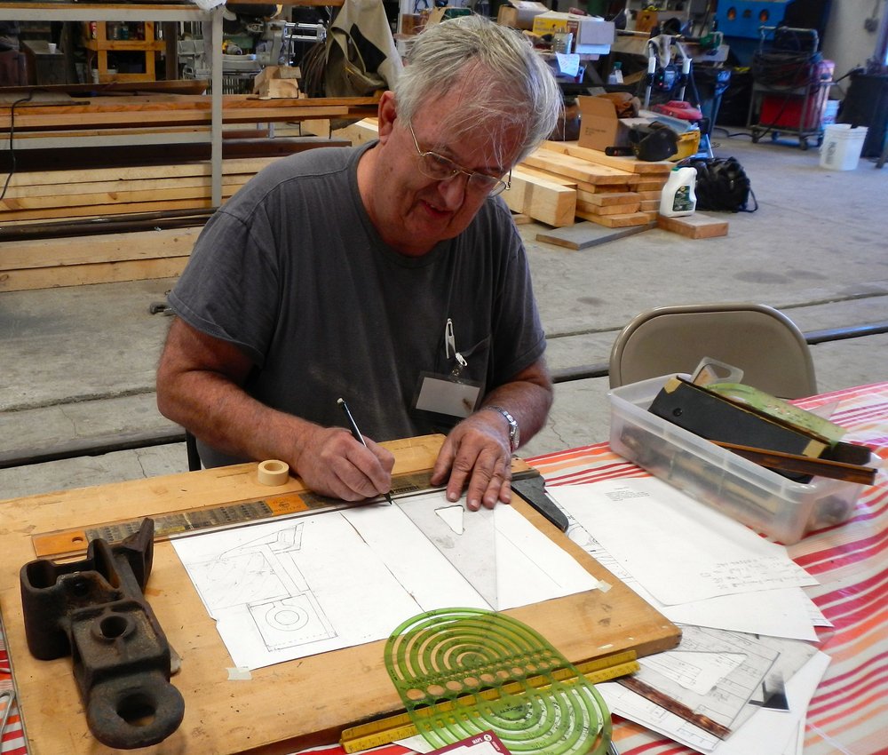 Pattern maker John Weiss making a drawing so he can carve a pattern for new brake hangers for the truck project.  New ones will cast in steel - We need a bunch!.jpg