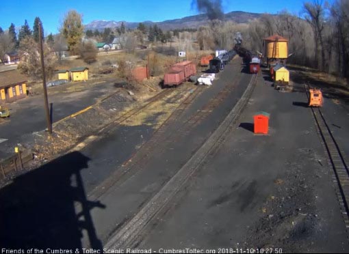 2018-11-10 The locomotives are into the curve as the heritage coach passes the tank.jpg