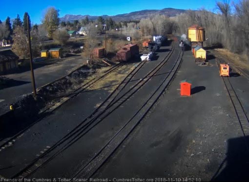 2018-11-10 The 487 passes the tank with its 4 car train.jpg