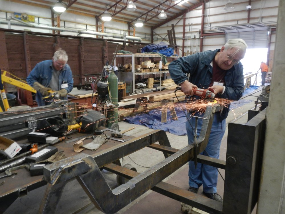 Russ Hanscom and John Weiss cleaning welds on truck sub assemblies..jpg