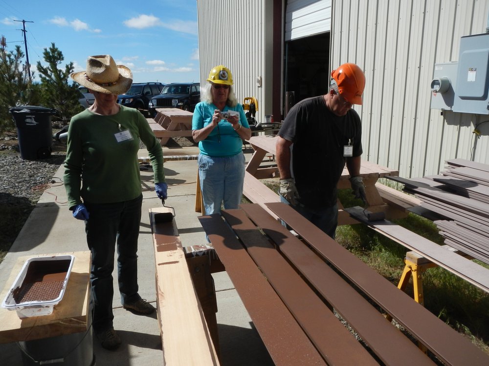 Sharon McGee, center documenting Valley Lowrance and Bruce Bloom working priming Osier Section house siding..jpg