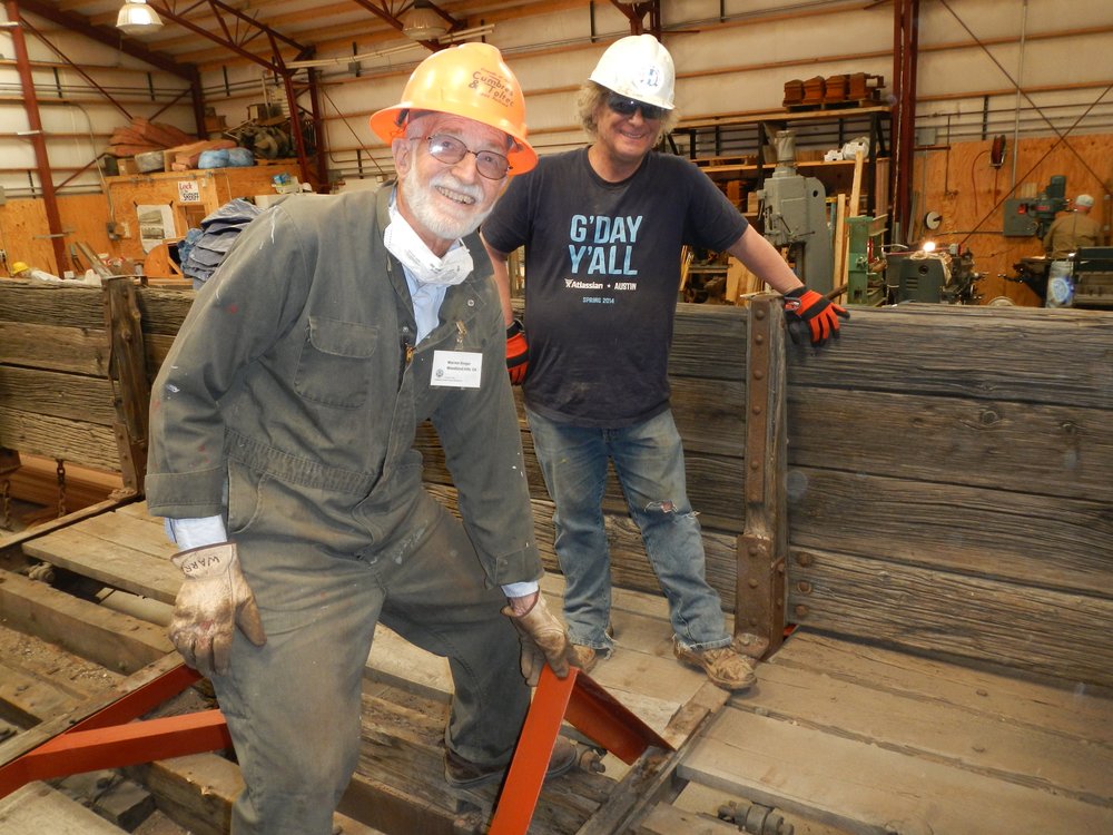 Team Leader Warren Ringer and Bill Kepner figuring the best way to attach metal A frame brackets to DBG 769..jpg