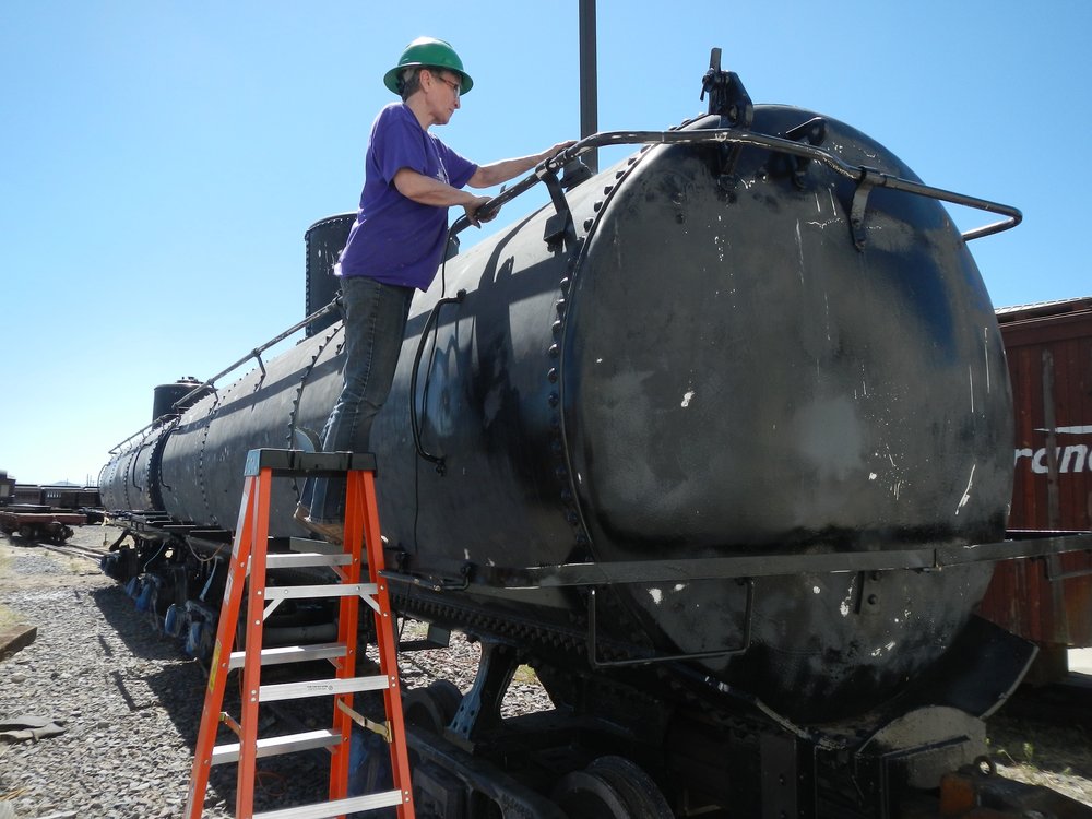 Valley Lowrance is prepping the Frameless tank cars for painting by roughing up any remaining glossy..jpg