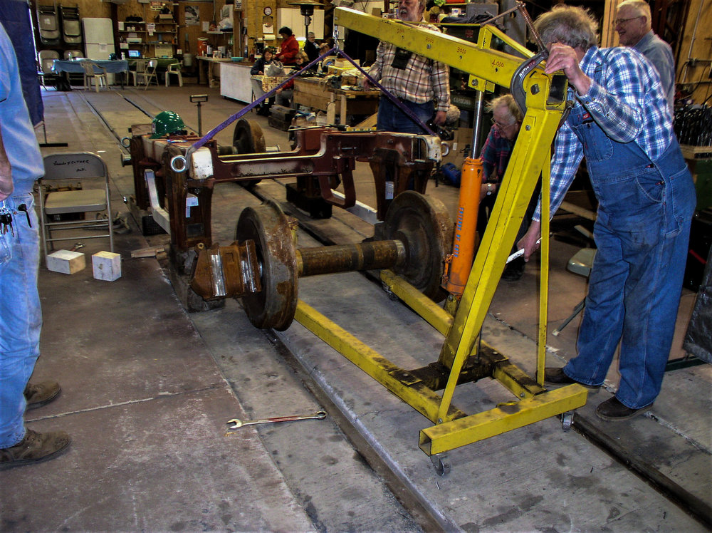 Anotther view of the wheel being moved so the frame can be lowered on it.jpg