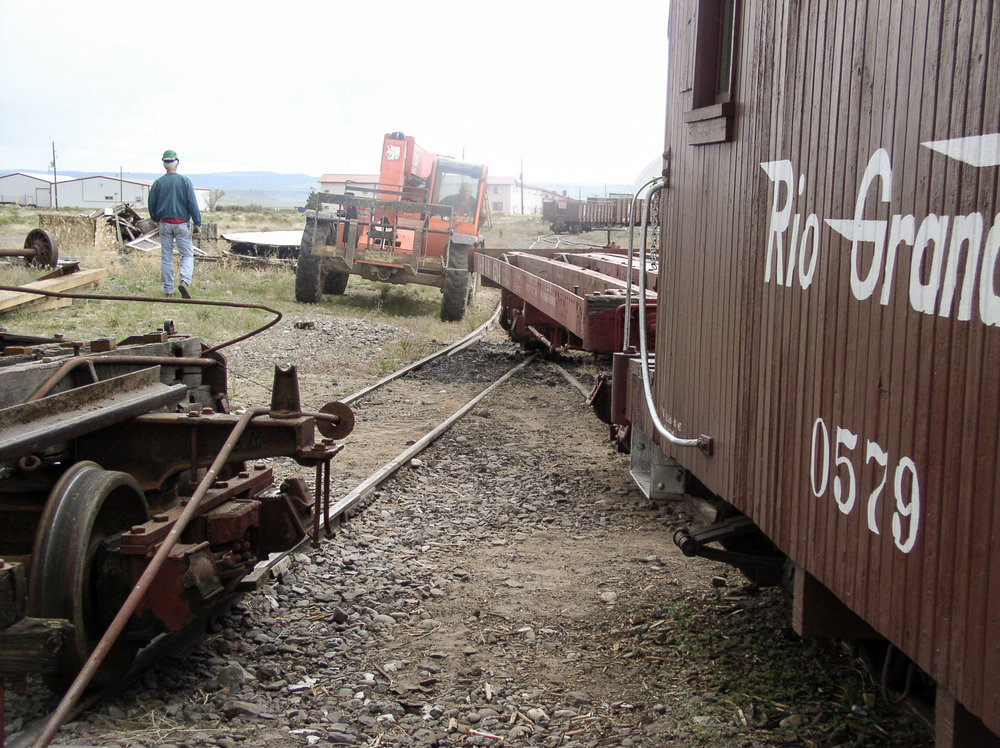 The steel frame flat is being pulled by an all terrrain fork lift.jpg