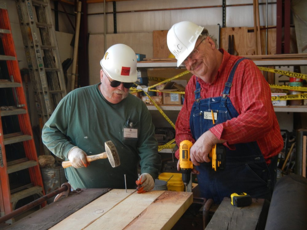 L to R Tom Hiscox and Bill McCartin laying down new flooring on Flat 6314 soon to be a rider gon.jpg