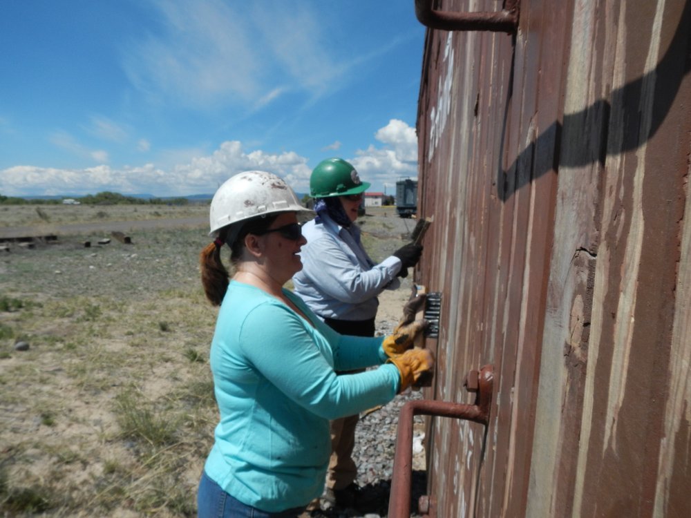 Jill Stewart and Judith Rosenberger are working the concession potty car - the paint applied last year failed badly - we had almost no penetration of primer..jpg