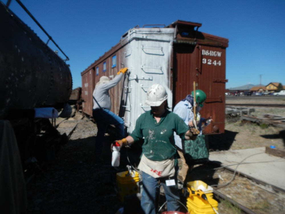 Concession Potty 3244 has the first primer coat Don going up the car Jill in the foreground,  Judith Rosenberger.jpg