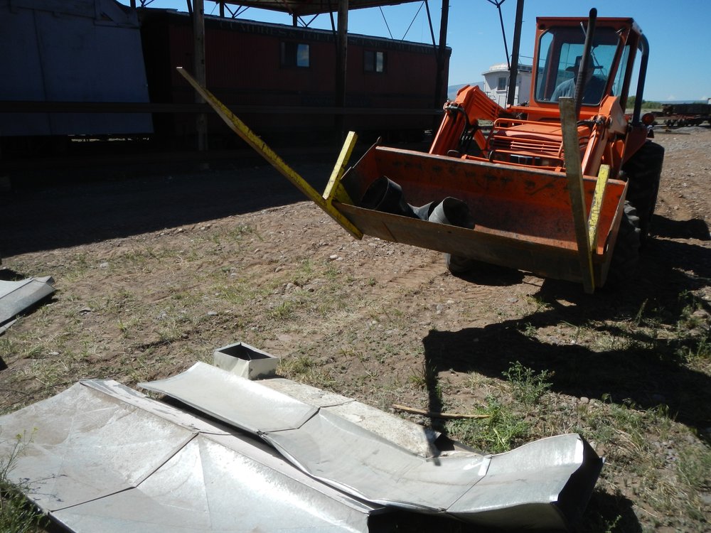 D&RG Box car 3166 acquired years ago from an Alamosa Scrapper was loaded with junk air ducts - We are loading them in the Dumpster after they have been squashed on a space available basis..jpg