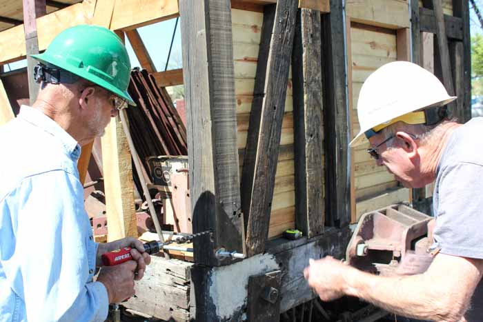 6.19.19 Two members of the crew working on the conversion of the Pbox 213 back to boxcar 3476 working on bracing (1 of 1).jpg