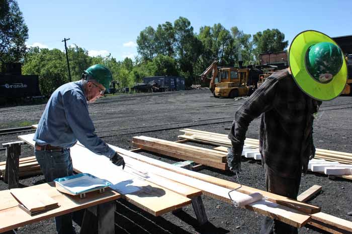 6.19.19 Applying primer to the boards to be used on the converted boxcar (1 of 1).jpg