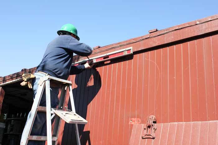 6.20.19 Getting that top rail lever so the door will move easily (1 of 1).jpg