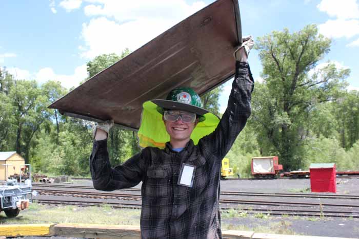 2019.06.21 The young member of the 5553 crew is carrying a piece of sheet metal (1 of 1).jpg