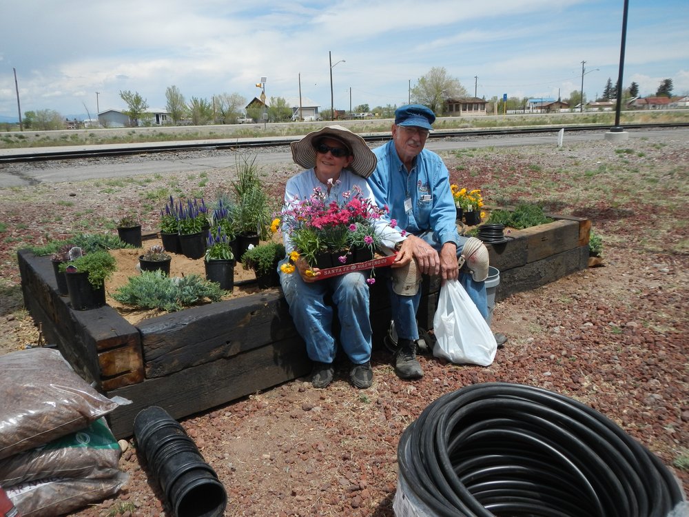 Flower power  Naomi and Jim sublette working hard on the new Antonito Depot Flower Garden.jpg