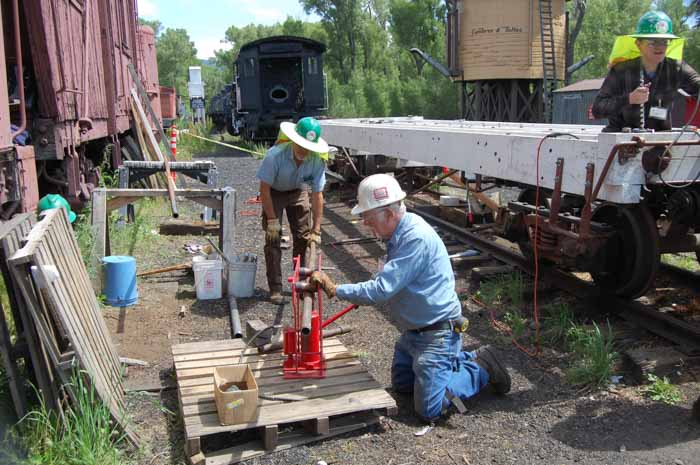 2019.06.26 The 1204 crew works on bending pipe to fit under the car (1 of 1).jpg