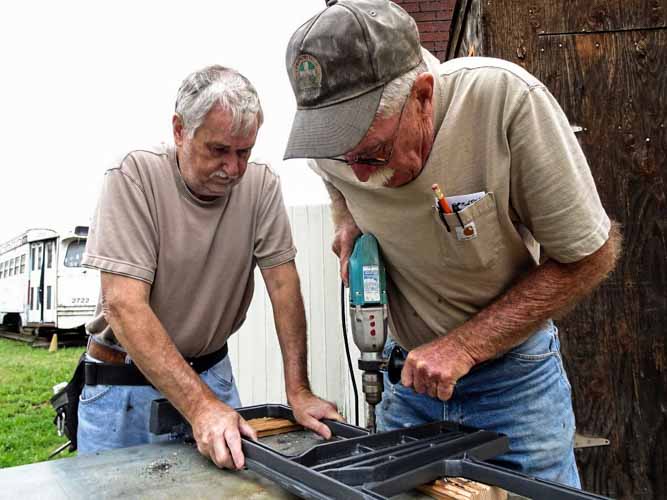 2019.07.06 Craig McMullen is drilling holes in the frame (1 of 1).jpg