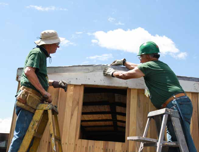 2019.07.29 Wrapping the roof material over the end of 3476 (1 of 1).jpg