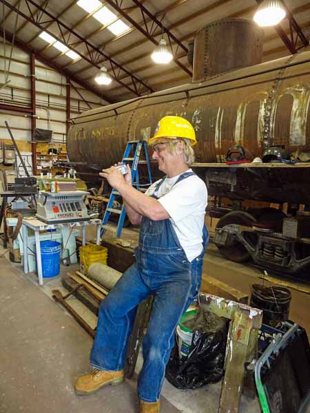 2019.08.05 A member sits on a sawhorse next to the Gramps tank car (1 of 1).jpg