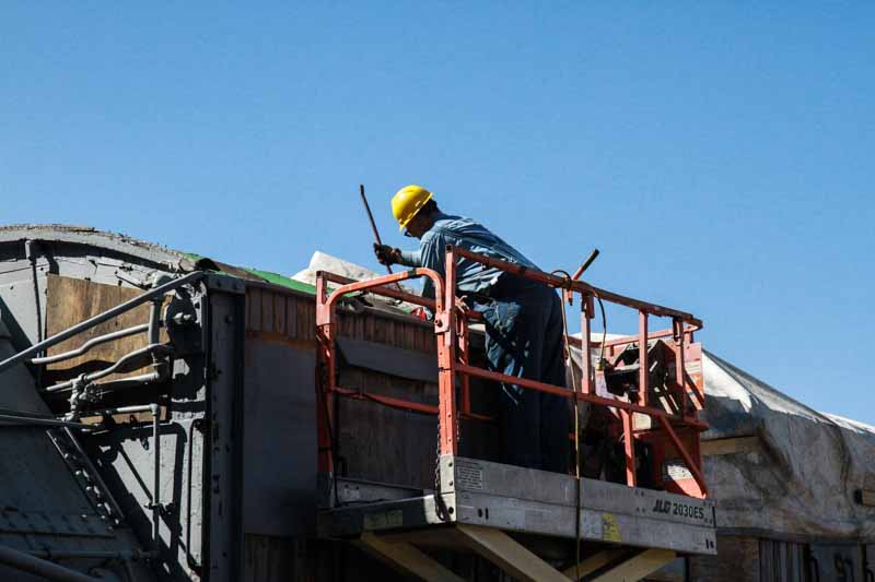 2019.08.24 Using a fine tool, a crowbar, to get the old roof material off the OY (1 of 1).jpg