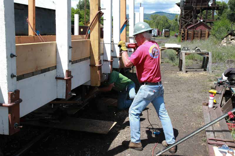 2019.08.05 Installing the bolts to hold the side board to the uprights (1 of 1).jpg