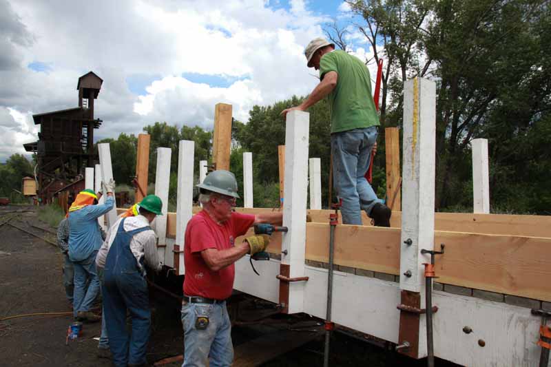 2019.08.05 The team is getting the side board attached (1 of 1).jpg